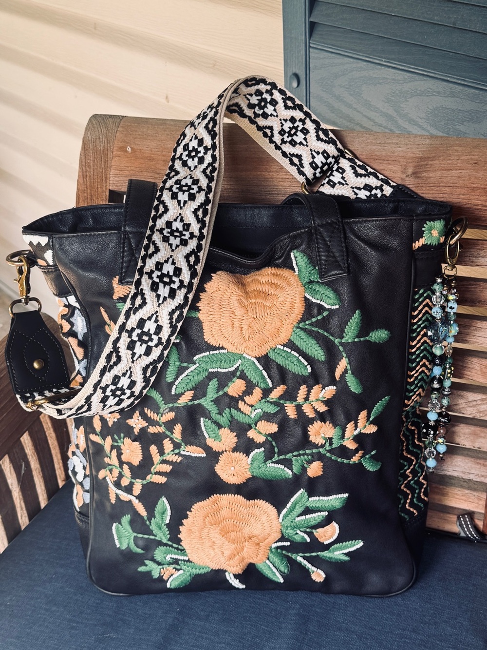 Black Floral Embroidered Tote with Peach Accents and Patterned Strap